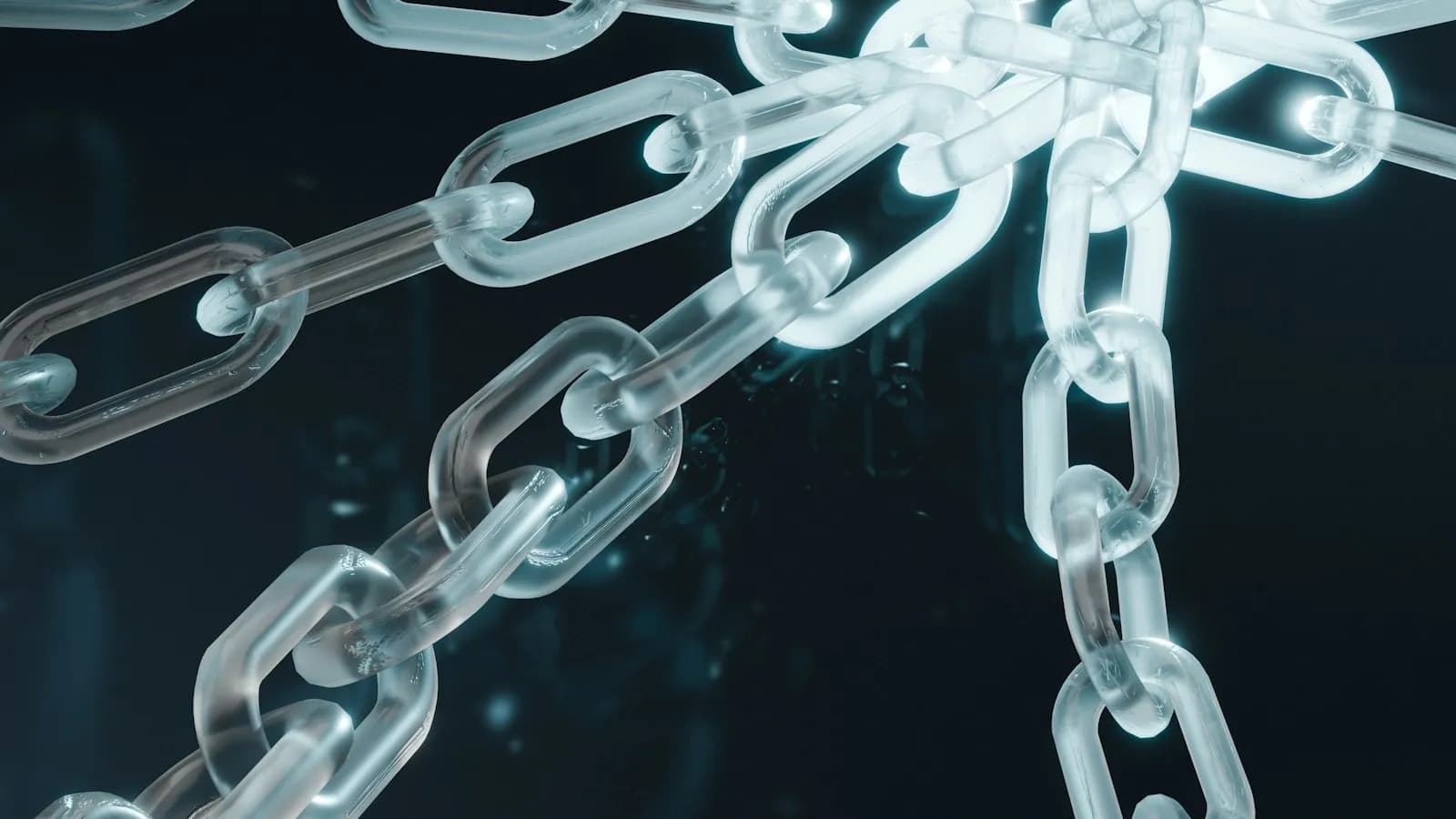 A close-up of a white and blue metal chain on a dark background